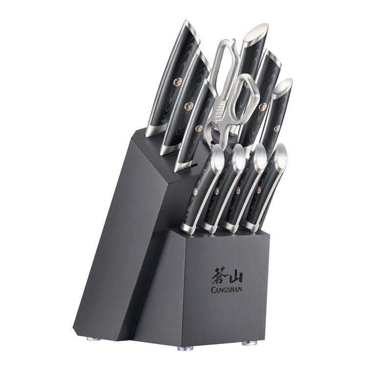 12-piece knife block set with black handles, including chef, paring, utility knives, kitchen shears, and steak knives.
