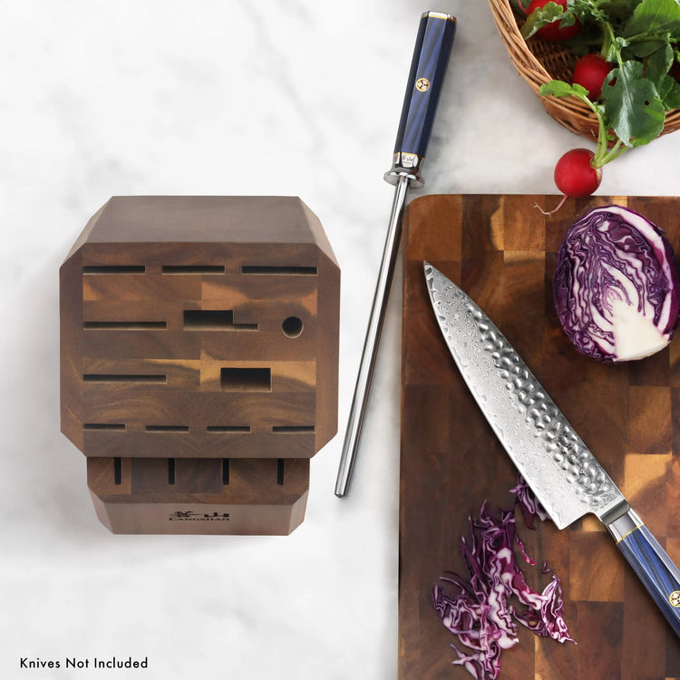 Empty acacia wood knife block with 16 slots, flat top, next to a sharpening rod and a cutting board with a knife and sliced p