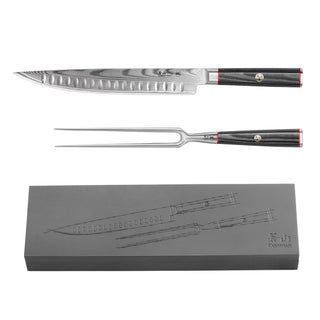 
                    
                      Carving knife and fork with black handles and Damascus steel blades, displayed above a matching ash wood storage box.
                    
                  
