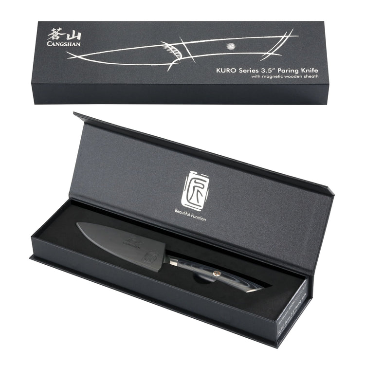 3.5-inch paring knife with black handle and sheath, displayed in an open black presentation box with branded lid.