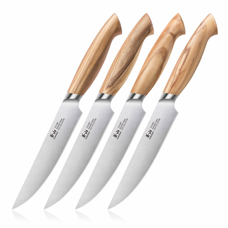 Four steak knives with polished wooden handles and stainless steel blades arranged in a row.