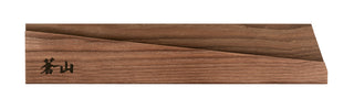 
                    
                      Solid ash wood magnetic knife sheath with a smooth finish and engraved black characters on one end.
                    
                  