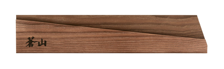 Solid ash wood magnetic knife sheath with a smooth finish and engraved black characters on one end.