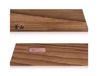 
                    
                      Solid ash wood magnetic knife sheath with engraved logo and metal label on smooth wooden surface.
                    
                  