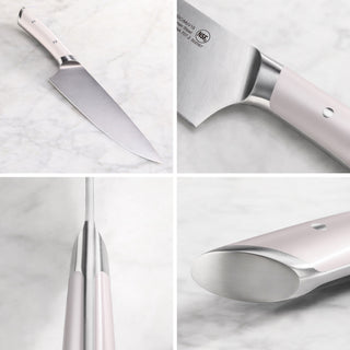 
                    
                      Chef knife with a stainless steel blade and light pink handle shown from multiple angles on a marble surface.
                    
                  