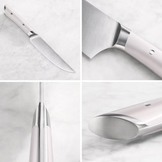 
                    
                      Four close-up views of a steak knife with a white handle and stainless steel blade on a marble surface.
                    
                  