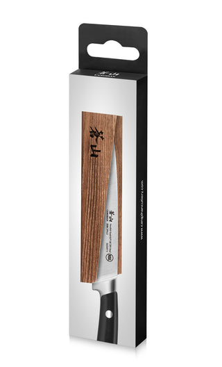 
                    
                      Solid ash wood magnetic knife sheath partially covering a kitchen knife with a black handle.
                    
                  
