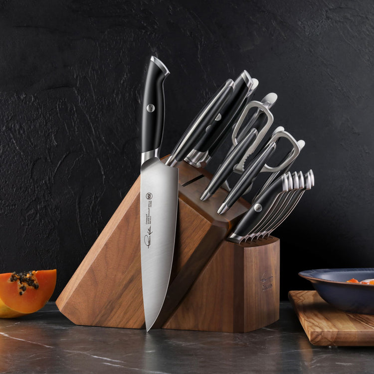 TKSC 17-piece knife block set with forged steel knives and kitchen shears stored in a wooden knife block.