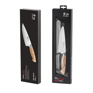 
                    
                      6-inch chef's knife with wooden handle displayed in black retail packaging from OLIV Series.
                    
                  