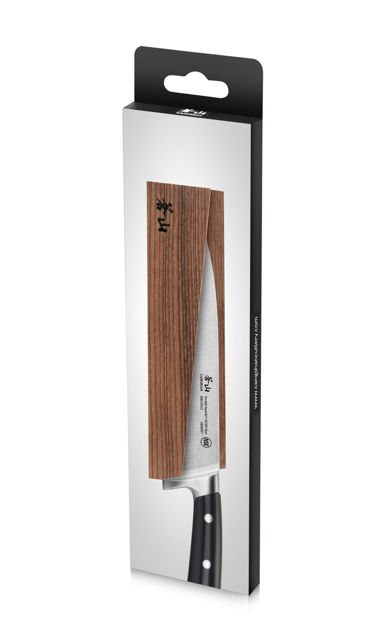 Magnetic knife sheath made of solid ash wood holding a kitchen knife with a black handle.