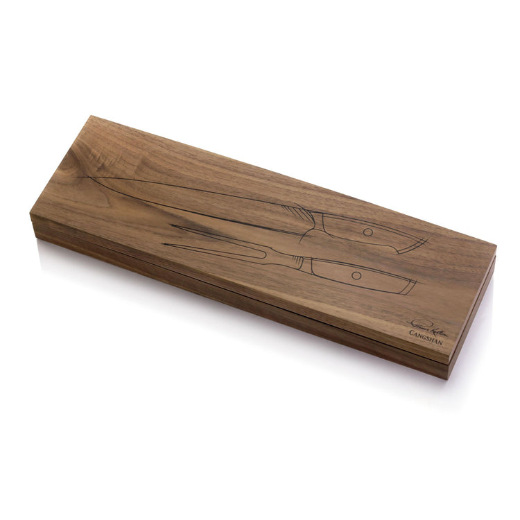 Wooden box with engraved outlines of a carving knife and fork, signed by Thomas Keller.