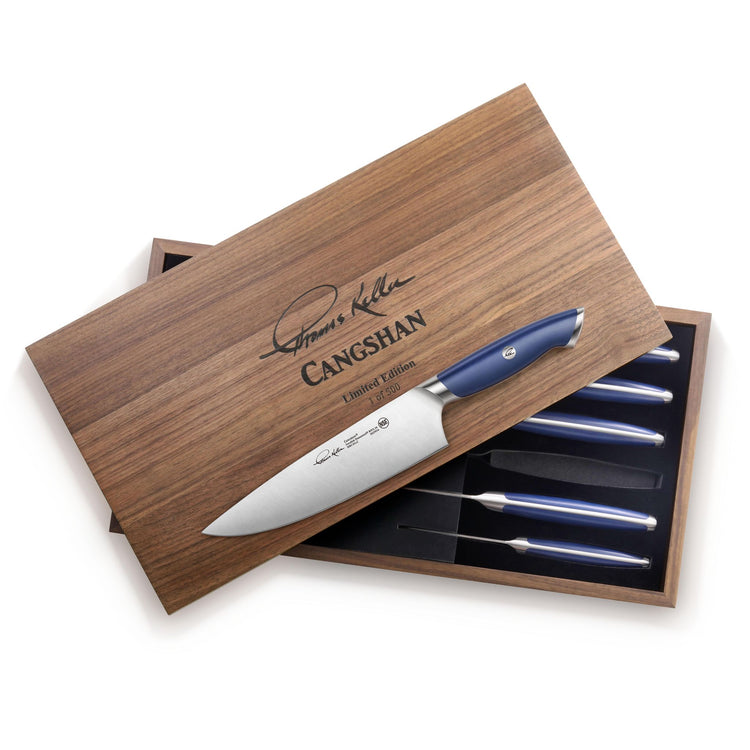 Wooden box with a set of six blue-handled knives, one knife resting on the box lid.
