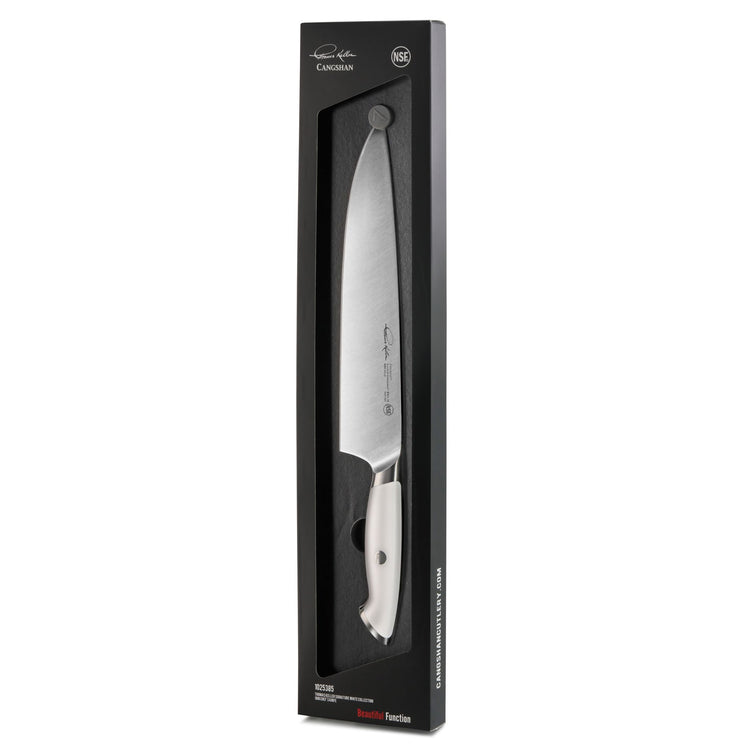 10-inch chef's knife with white handle in black packaging, part of Thomas Keller Signature Collection.