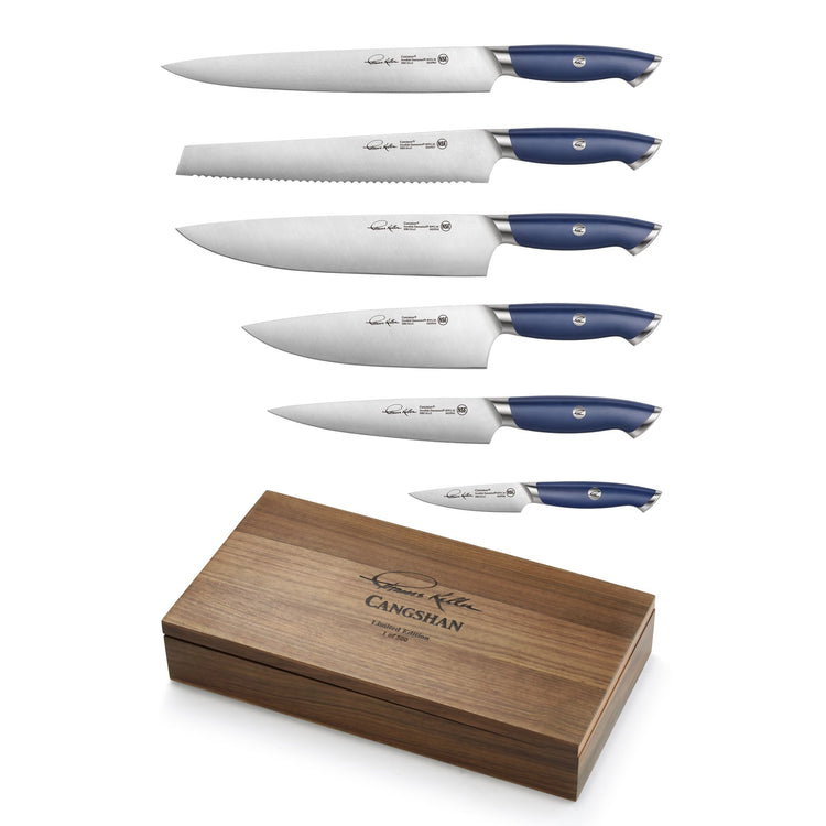 Six blue-handled knives of varying sizes arranged above a closed wooden box with engraved text.